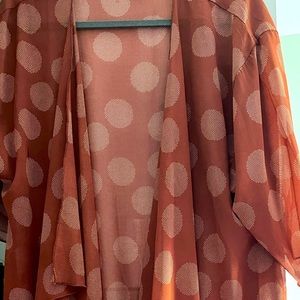 Lularoe Shirley rust brown with cream colored circle pattern. Size medium